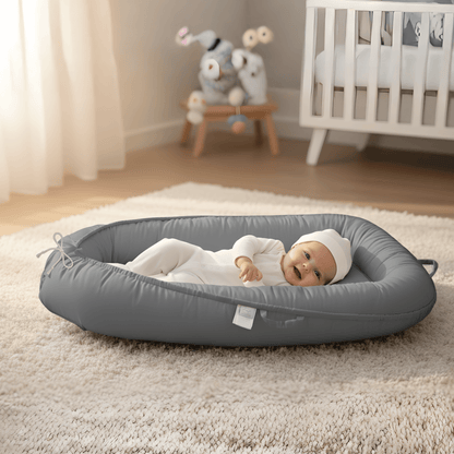 3D-Touch Breathable Lounger for Newborns with a smiling baby lying comfortably in a soft, gray mesh lounger. 3D-Touch Breathable Lounger for Newborns